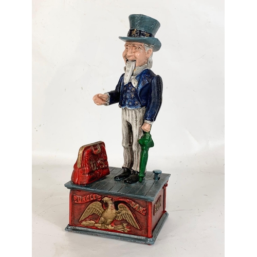 174 - An old style cast iron money box. 28cm.