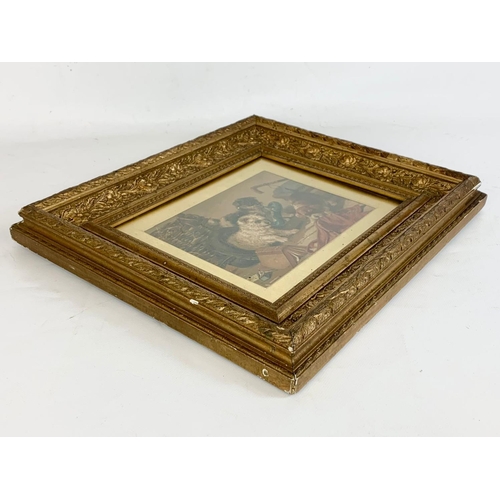 189 - A late Victorian gilt framed print of puppies. 38.5 x 33cm.