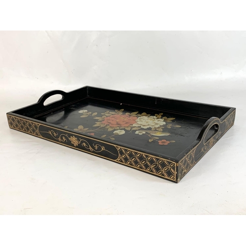 241 - 2 Chinese lacquered serving trays. 53 x 33 x 7cm