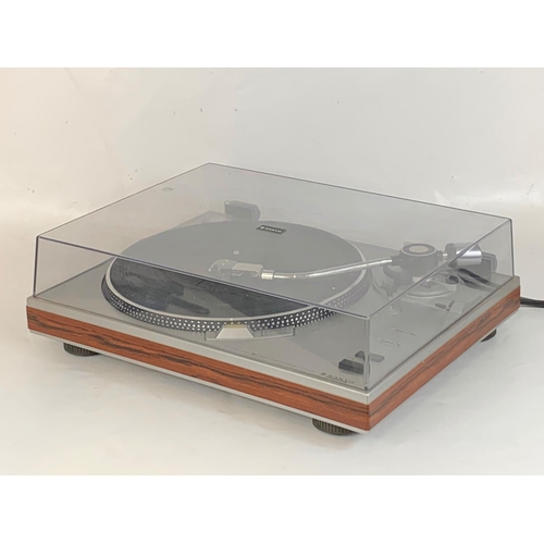 246 - A vintage Sanyo turntable record player with rosewood banding. TP-1010 PLL Servo Drive. 44 x 34.5 x ... 