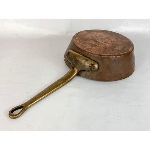 250 - A large Victorian copper and brass pan. 58cm