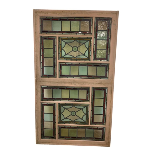 26 - A large Victorian stained glass and lead panel in wooden frame. 103 x 177.5cm.