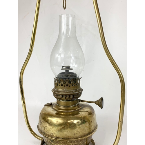 262 - An early 20th century brass hanging oil lamp. Circa 1900. 60cm.