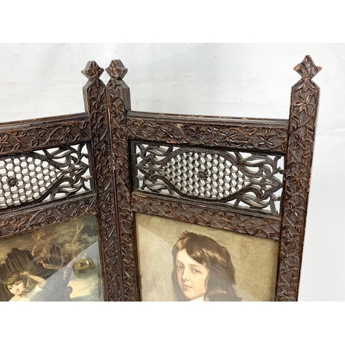 263 - An Edwardian ornate mahogany folding screen. 86 x 78.5cm.