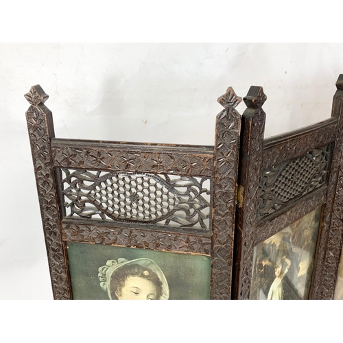 263 - An Edwardian ornate mahogany folding screen. 86 x 78.5cm.