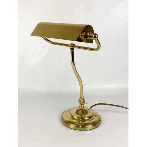 265 - A heavy brass adjustable desk lamp. 38cm.