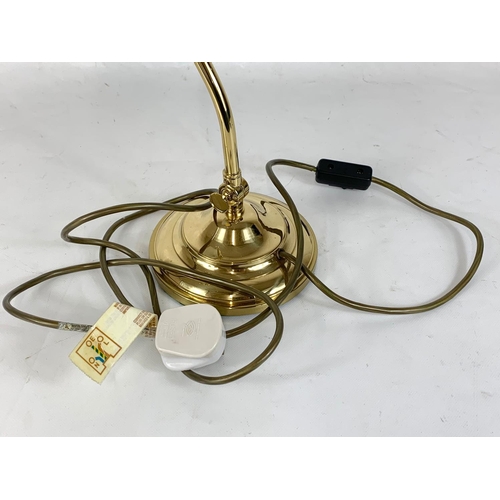 265 - A heavy brass adjustable desk lamp. 38cm.