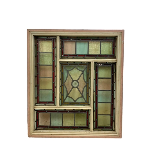 27 - A large Victorian stained and lead glass panel in a wooden frame. 86.5 x 98cm.