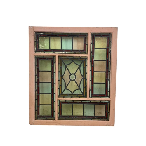 27 - A large Victorian stained and lead glass panel in a wooden frame. 86.5 x 98cm.