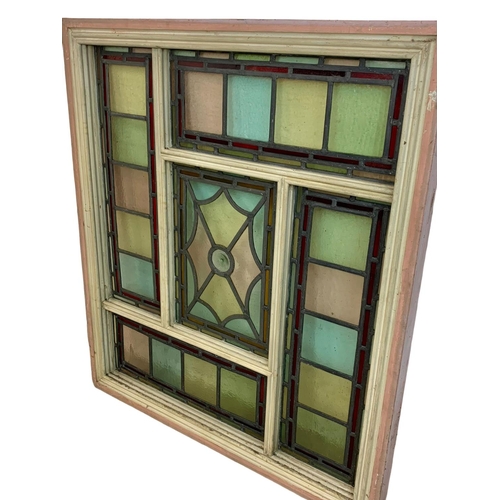 27 - A large Victorian stained and lead glass panel in a wooden frame. 86.5 x 98cm.