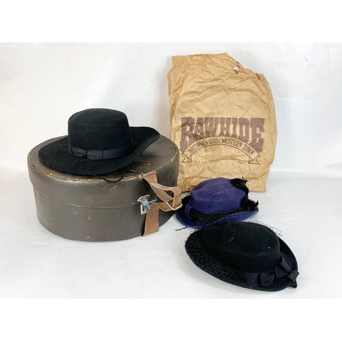 270 - A vintage hat box with 3 hats. Box measures 45 x 20cm.