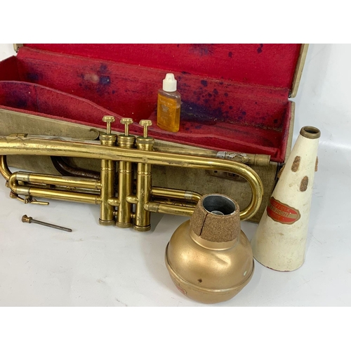 272 - A vintage Dallas “Monarch” trumpet in case.