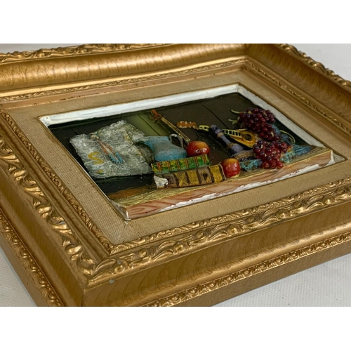 277 - A set of 3 gilt framed plaques. 30 x 24.5cm.