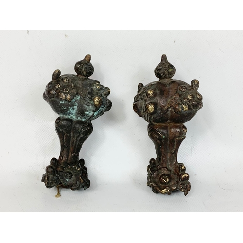 279 - A pair of 19th century French clock weights. 17cm