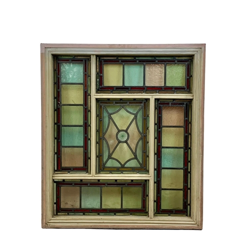 28 - A large Victorian stained and lead glass panel in a wooden frame. 86.5 x 98.5cm.