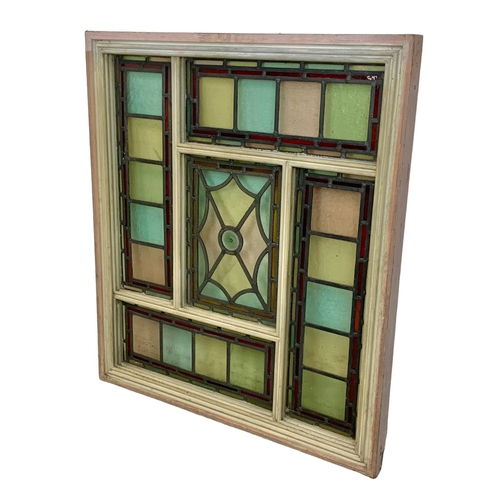 28 - A large Victorian stained and lead glass panel in a wooden frame. 86.5 x 98.5cm.