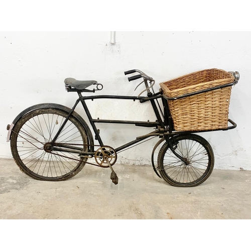 281 - An early 20th century Raleigh shops carrier Butcher Bike. Bike measures 186cm. Basket measures 62 x ... 