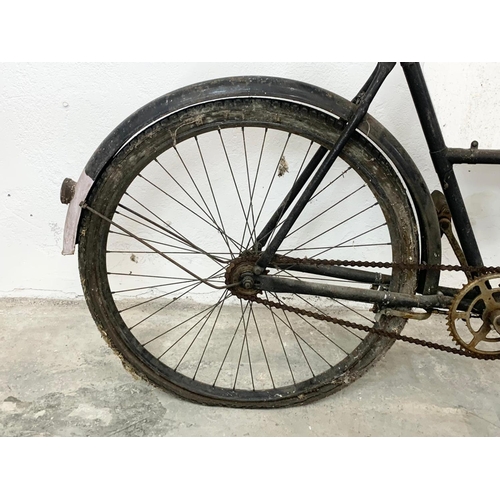 281 - An early 20th century Raleigh shops carrier Butcher Bike. Bike measures 186cm. Basket measures 62 x ... 