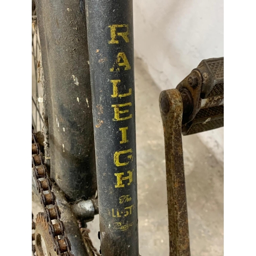 281 - An early 20th century Raleigh shops carrier Butcher Bike. Bike measures 186cm. Basket measures 62 x ... 