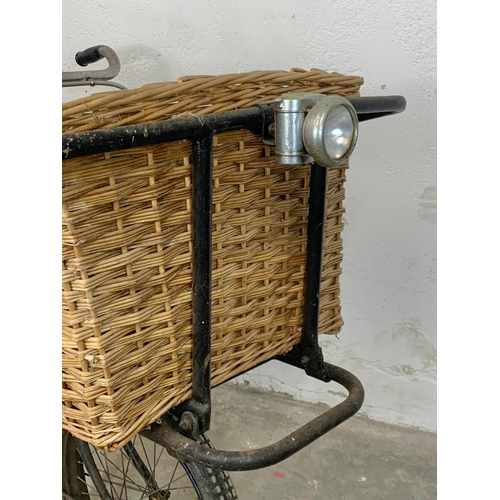 281 - An early 20th century Raleigh shops carrier Butcher Bike. Bike measures 186cm. Basket measures 62 x ... 