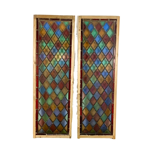 287 - A pair of large late 19th century stained glass panels. 57.5 x 179cm.