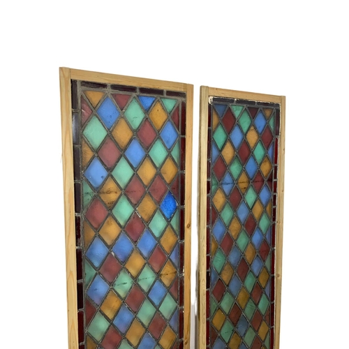 288 - A pair of large late 19th century stained glass panels. 57.5 x 179cm.