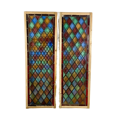 288 - A pair of large late 19th century stained glass panels. 57.5 x 179cm.