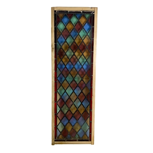 289 - A large late 19th century stained glass panel. 57.5 x 179cm