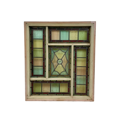 29 - A large Victorian stained and lead glass panel in a wooden frame. 86.5 x 99cm.