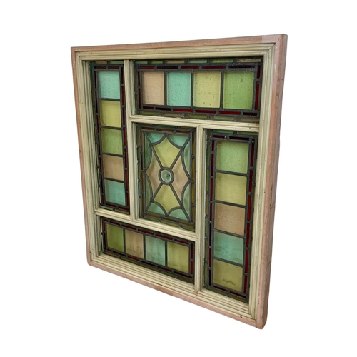 29 - A large Victorian stained and lead glass panel in a wooden frame. 86.5 x 99cm.