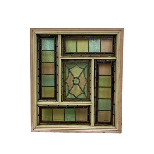 29 - A large Victorian stained and lead glass panel in a wooden frame. 86.5 x 99cm.