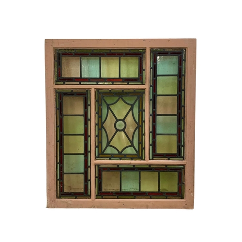 30 - A large Victorian stained and lead glass panel in a wooden frame. 86.5 x 98.5cm