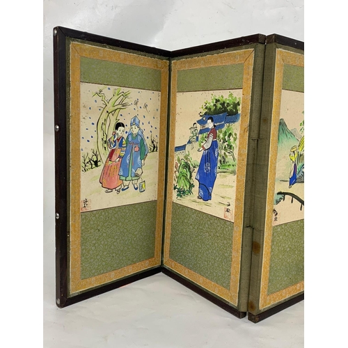 312 - A small early 20th century Japanese folding screen with hand painted watercolour panels. 114 x 38cm.