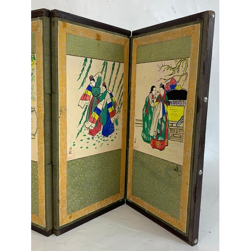 312 - A small early 20th century Japanese folding screen with hand painted watercolour panels. 114 x 38cm.