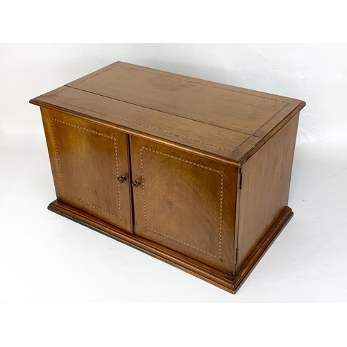 314 - An early 20th century inlaid mahogany table top cabinet. Circa 1910-1920. 56.5 x 33 x 32cm