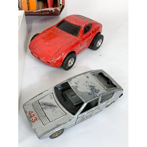 319 - A large quantity of models cars and trucks. Dinky, Corgi, Matchbox etc.