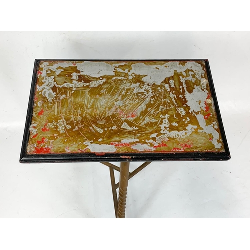 320 - A small Victorian brass table with revolving top. 38 x 47cm