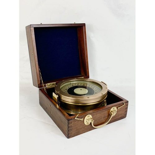 33 - An early 20th century Ships Compass by Dobbie McInnes LTD Glasgow in a mahogany case. Case measures ... 