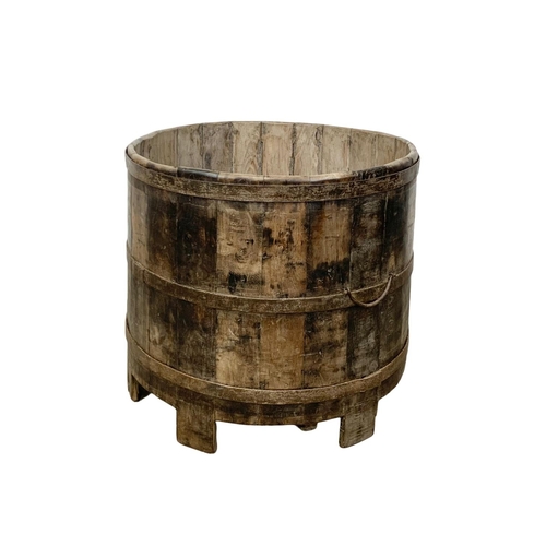 352 - A large late 19th century wooden Vat on stile feet. Circa 1890-1910.  69 x 63.5cm.