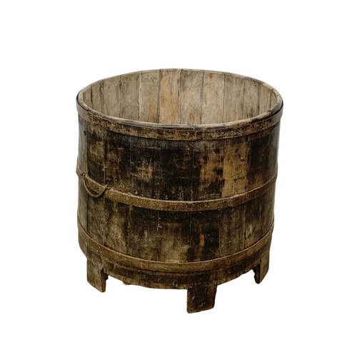 352 - A large late 19th century wooden Vat on stile feet. Circa 1890-1910.  69 x 63.5cm.