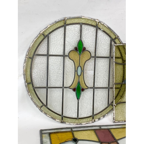 355 - A quantity of late 19th century stained glass. Largest 76cm.