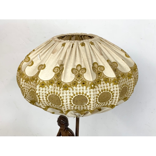 360 - A vintage plaster elephant table lamp with shade. 29 x 59cm