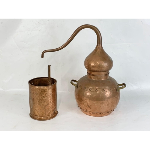 371 - An early 20th century copper Alembic. 32 x 52cm