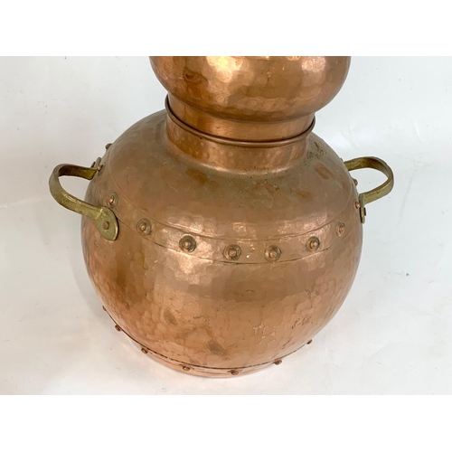 371 - An early 20th century copper Alembic. 32 x 52cm