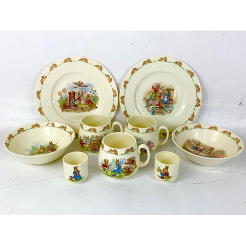 405 - 9 pieces of Royal Doulton Bunnykins pottery. A pair of plates, a pair of bowls, 3 mugs and 2 egg cup... 