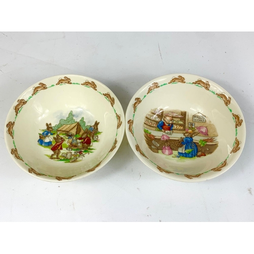 405 - 9 pieces of Royal Doulton Bunnykins pottery. A pair of plates, a pair of bowls, 3 mugs and 2 egg cup... 