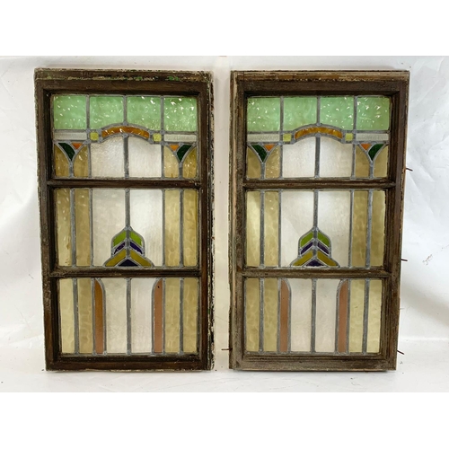 41 - A pair of large Victorian stained glass panels in wooden frames. 50 x 88cm