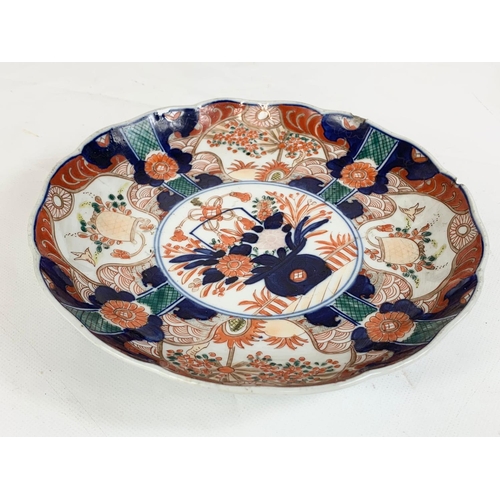 412 - 2 19th century Japanese Imari plates, 22cm