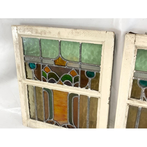 42 - A pair of Victorian stained glass panels in wooden frames. 50.5 x 60cm