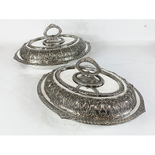 438 - A pair of good quality late 19th century ornate silver plated food servers. 31.5cm.